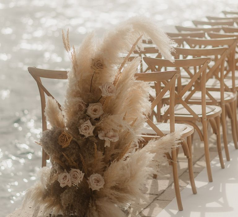 neutral dried flower arrangement with roses and pampas grass at coastal Croatia wedding