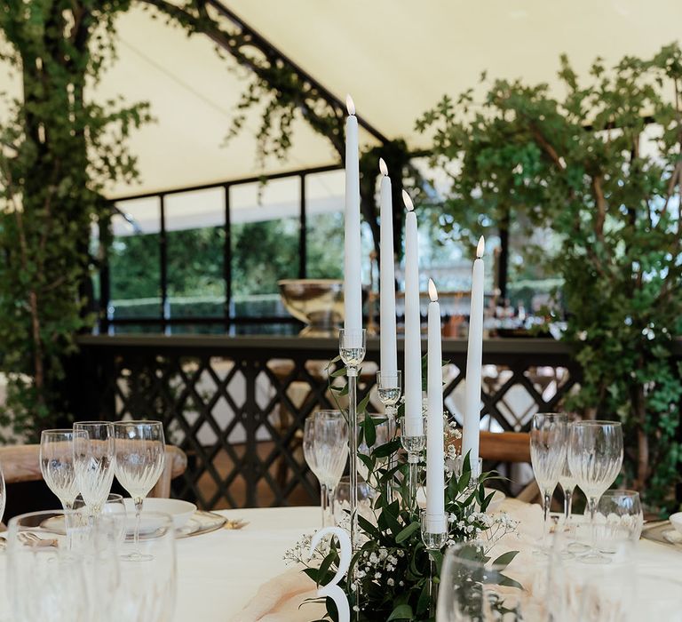 Neutral tone wedding drapery table runners with pale pink wedding flower table centrepiece 