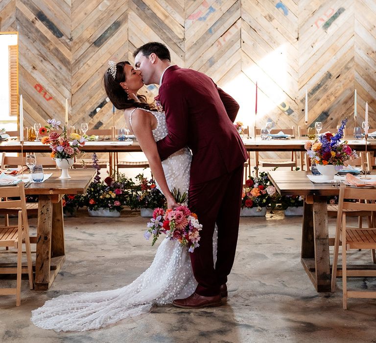 Bride and groom kiss at their wedding venue in Essex 