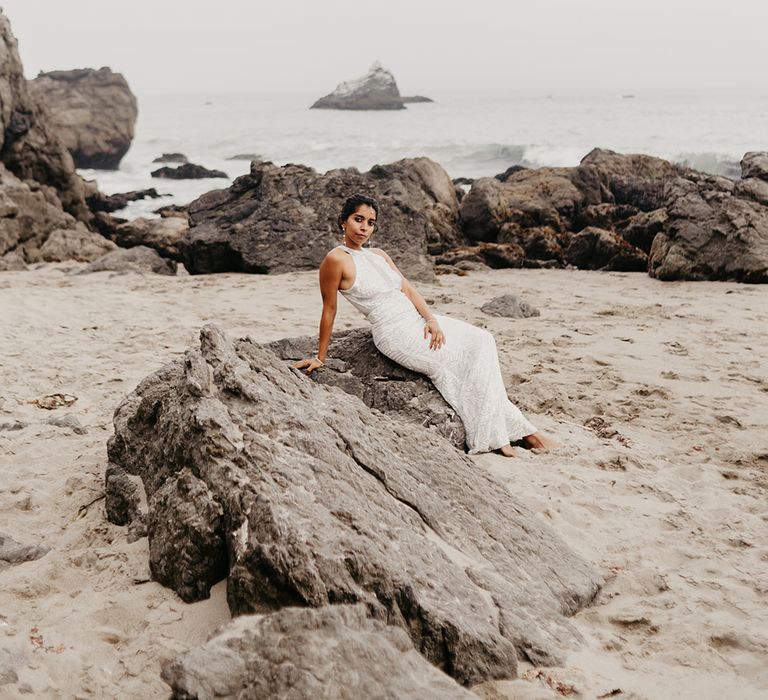 Stylish bridal portrait with bride in a silver halter neck wedding dress 