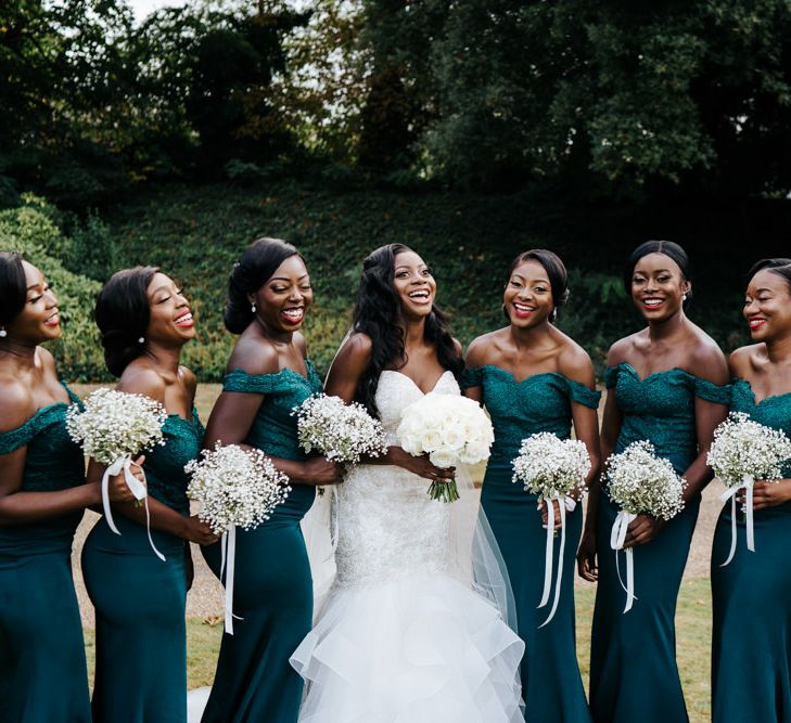 Bridal party portrait with bridesmaids in green dresses 