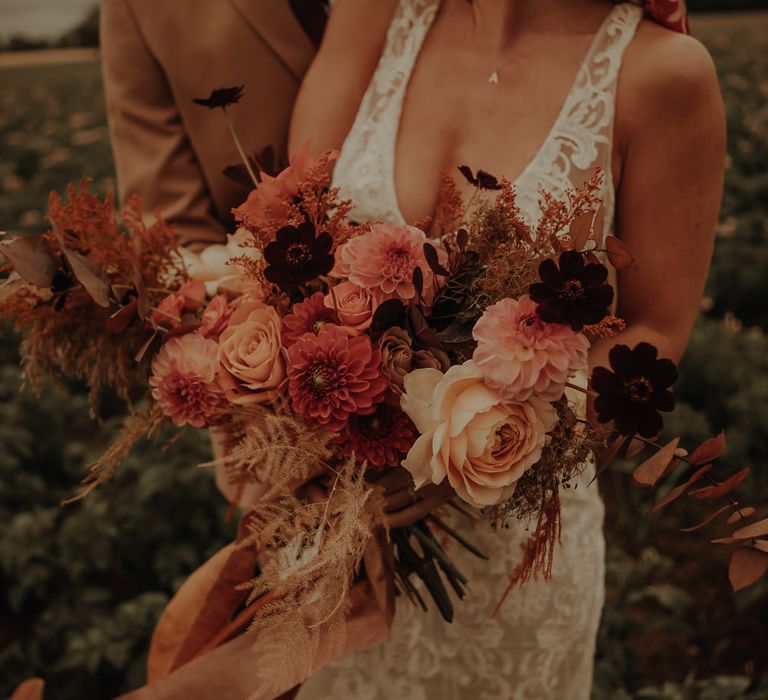 Orange and peach wedding bouquet with dahlias 