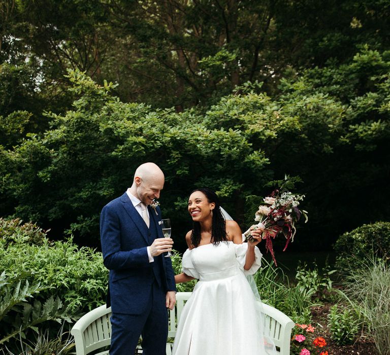 Bride in Emma Beaumont wedding dress and appliqué veil 