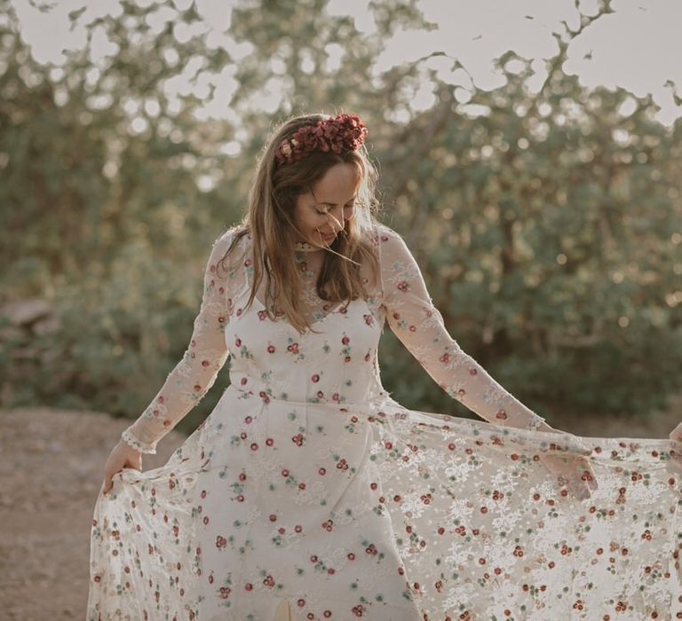 The bride wears a floral Immacle wedding dress