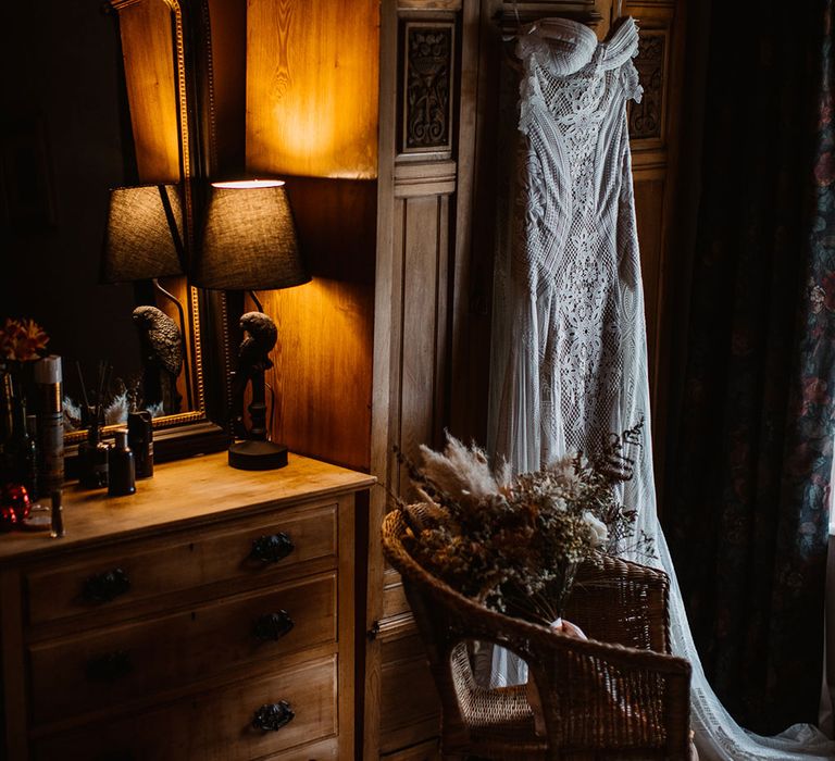 Rue de Seine Wedding Dress hung on wardrobe door