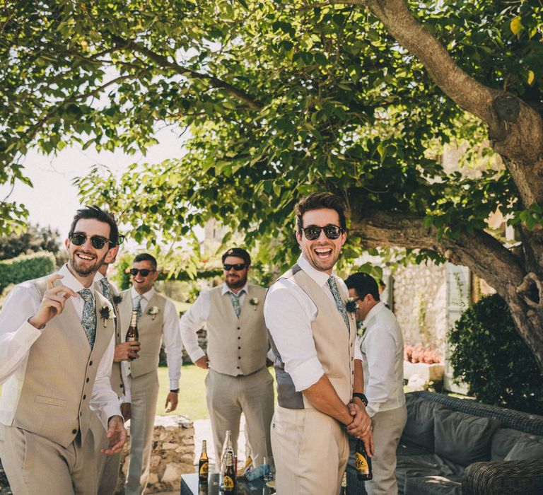 The groomsmean in matching M&S Suits, the groom wears a customer Caroline Andrew suit