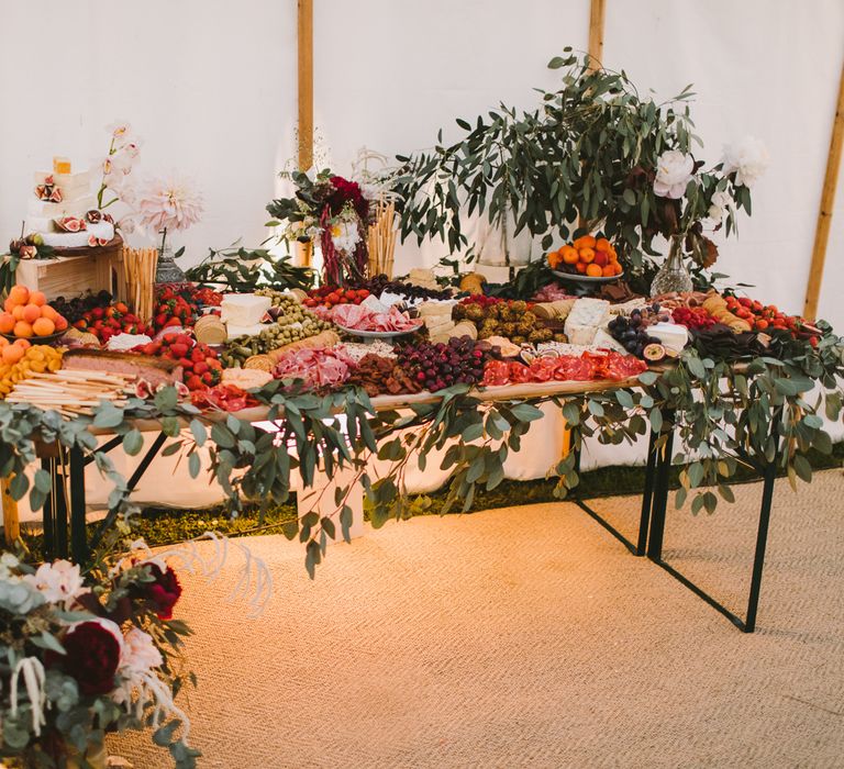 Grazing table featuring green foliage