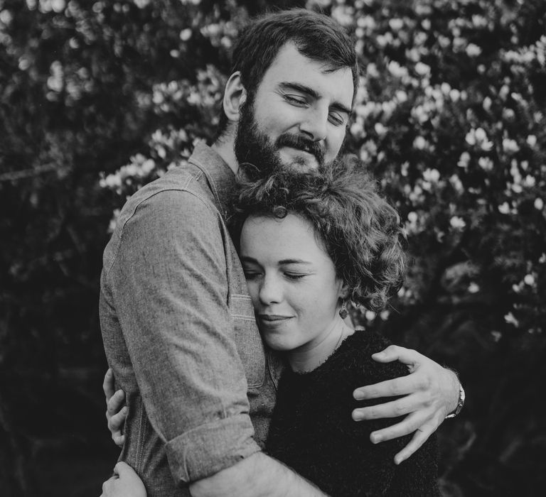 Couple embrace outdoors in the countryside