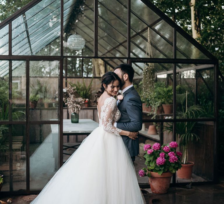 Huge tulle skirt princess wedding dress with long sleeves and lace detail by Sara Lobla Photography