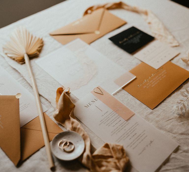 Vellum wedding stationery designs with gold foil typography 