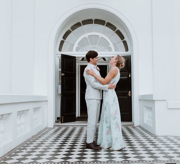 Bride & groom look lovingly at one another on the day of their wedding outside the Belair House