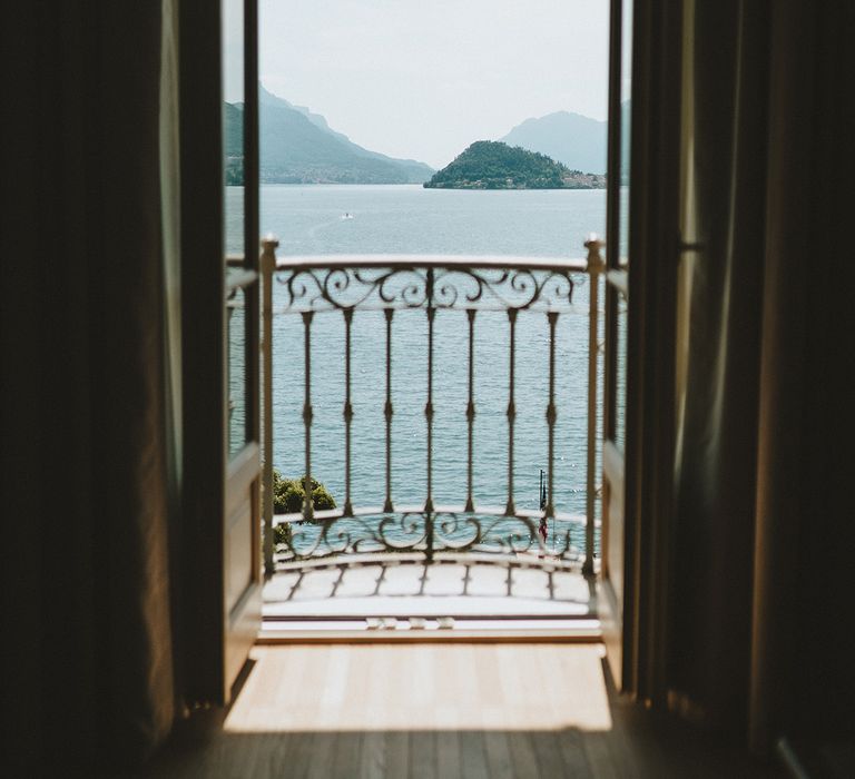 Balcony doors look out onto Lake Como at the Villa Balbiano 