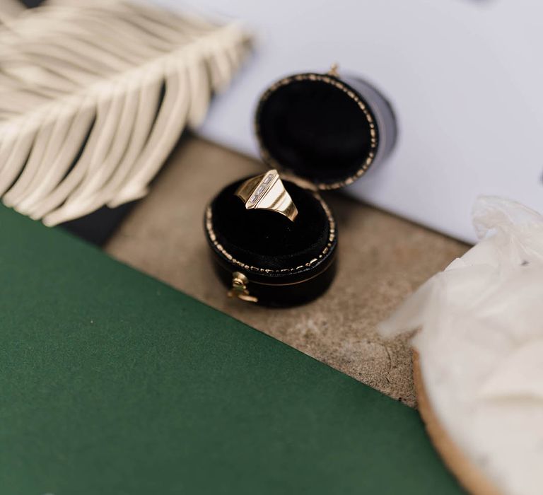 Gold signet ring in a ring box 