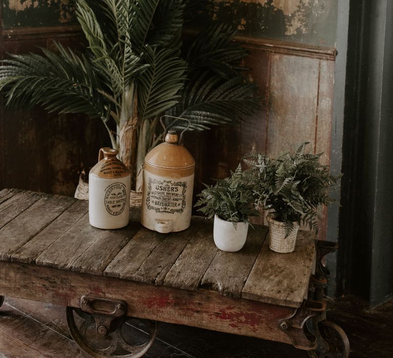 Rustic setting complete with jars filled with green foliage