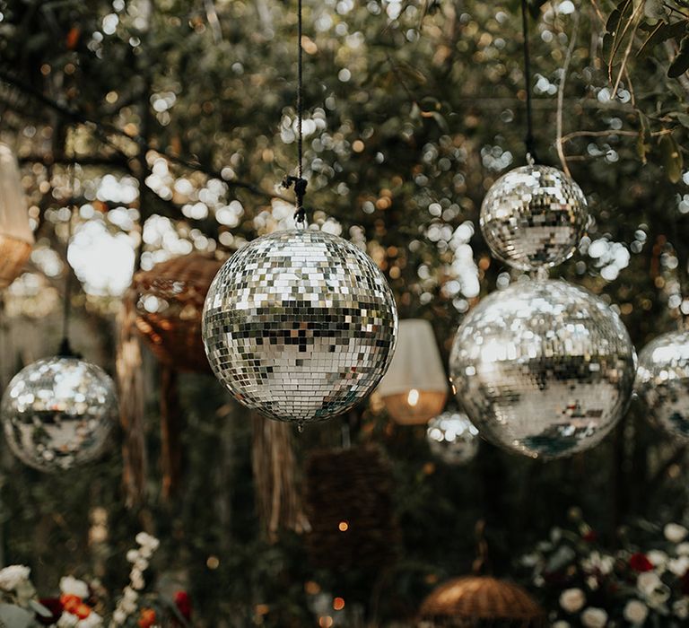 Disco ball wedding decor for outdoor jungle destination wedding in Mexico