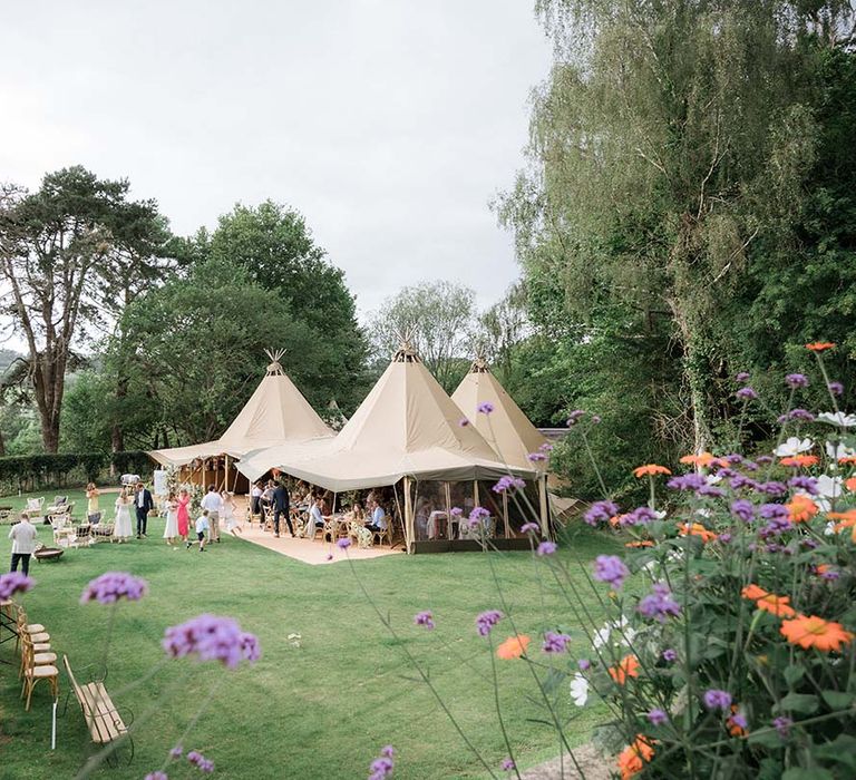 Buffalo Tipi for back garden wedding with expansive view of English countryside and flowers