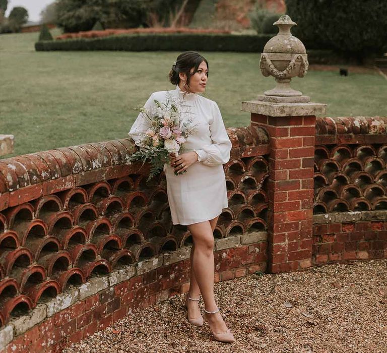 Bride in Vanessa Cocchiaro Paris short wedding dress at Leatherhead Registry Office, Wotton House