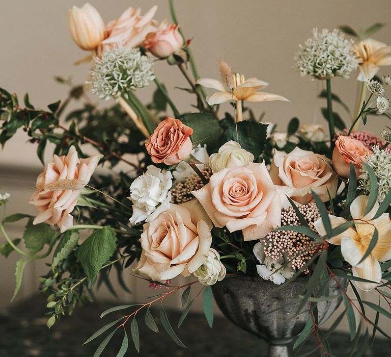 Blush pink and white wedding flower arrangement 