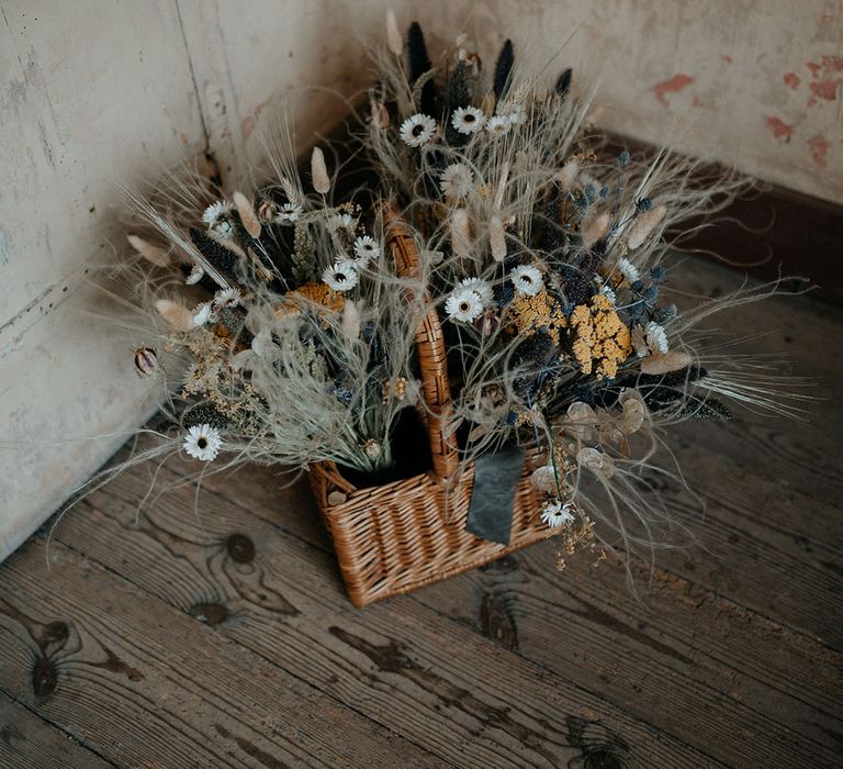 Dried floral bouquets in wicker basket 