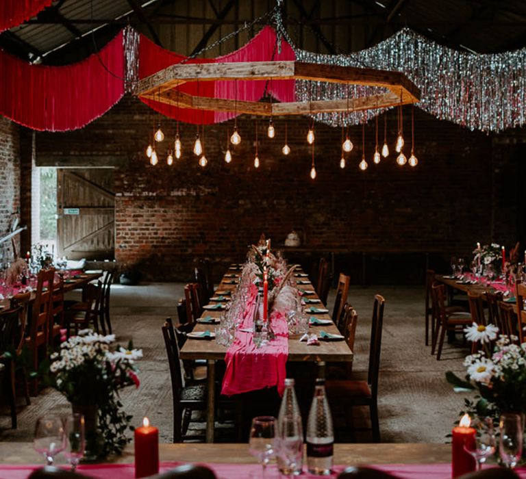 The Pantone Color of the Year 2023 is used to decorate this industrial venue with magenta streamer decor 