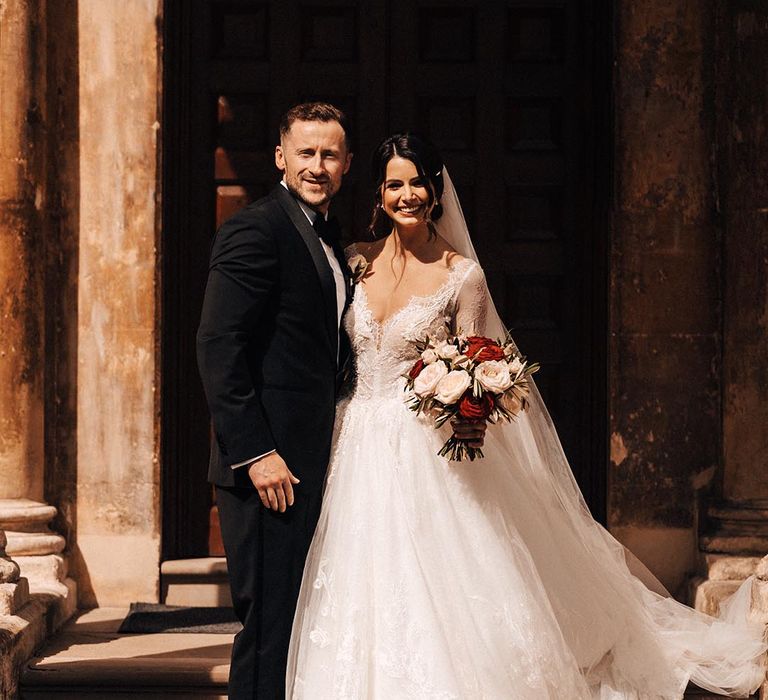 The bride and groom pose together for their couple portraits 