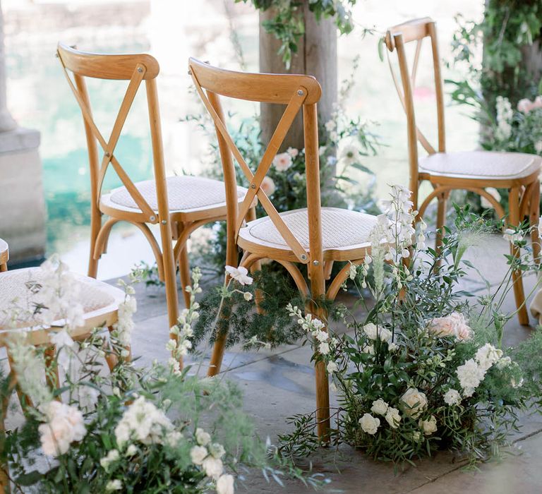 All white and pale pink wedding flowers with wildflowers for botanical style wedding aisle decor 