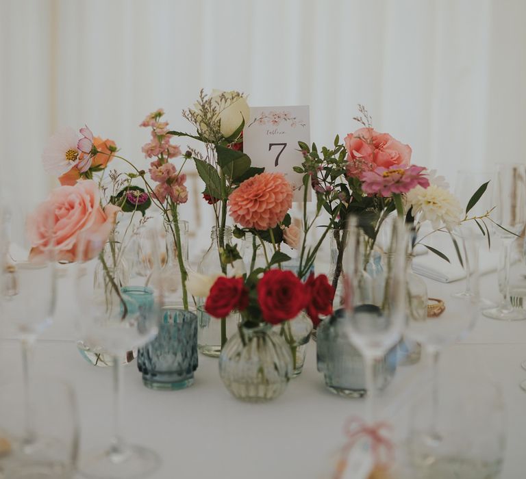 Bud vases with pastel wedding flowers for the table centrepiece decor for marquee wedding 