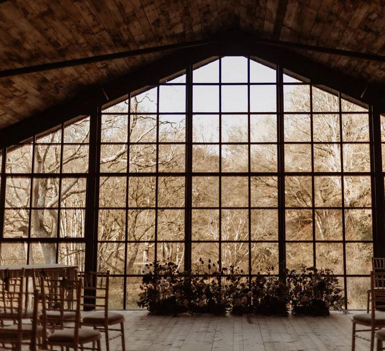 Hidden River Cabins wedding venue Cumbria - large windows looking out into the Cumbrian countryside and river 