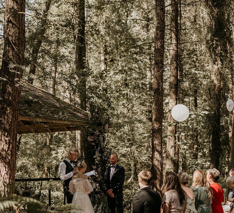 Humanist wedding ceremony at Camp Katur wedding venue with white paper lanterns 