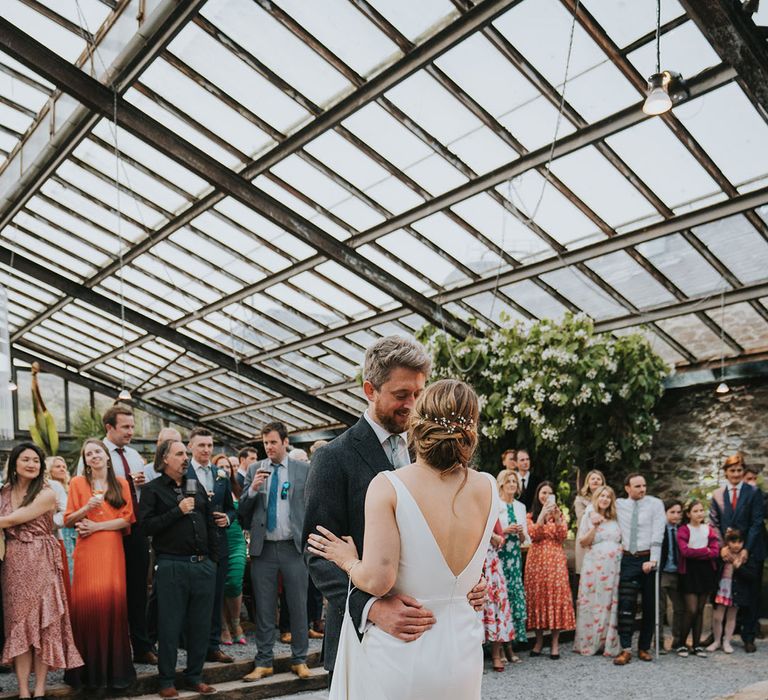 The bride and groom have their first dance together at the Anran Devon wedding venue 