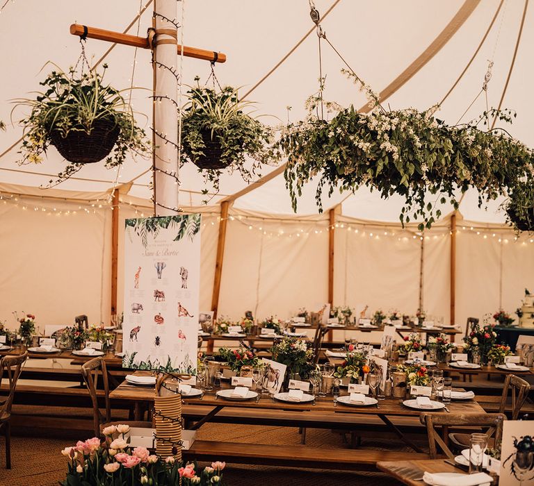 Foliage decorations at marquee wedding at home with tulips for spring wedding 