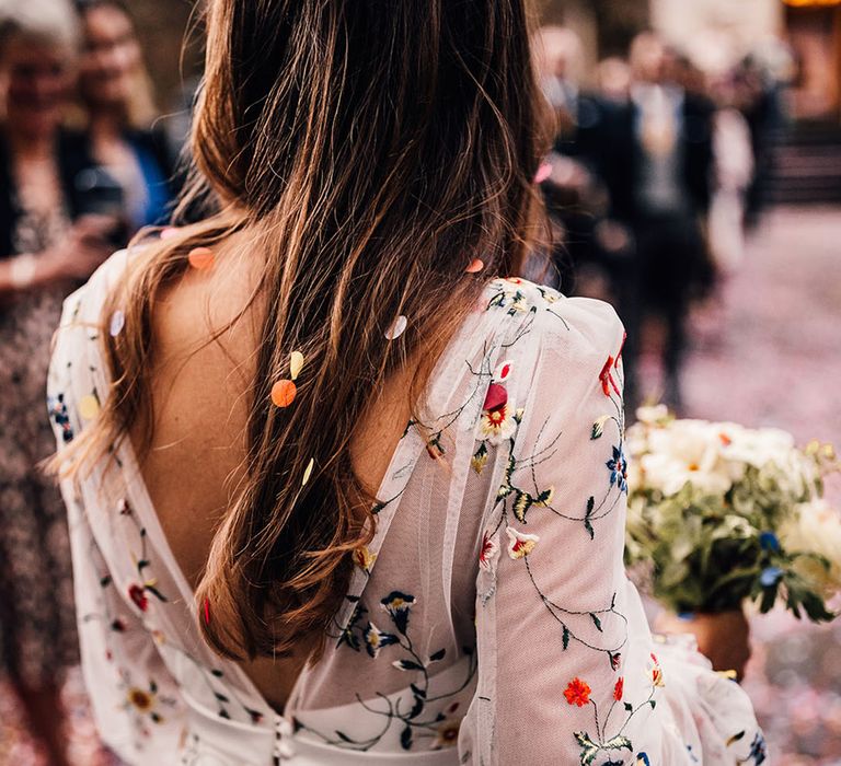 Stunning colourful floral embroidered wedding dress by Sassi Holford 