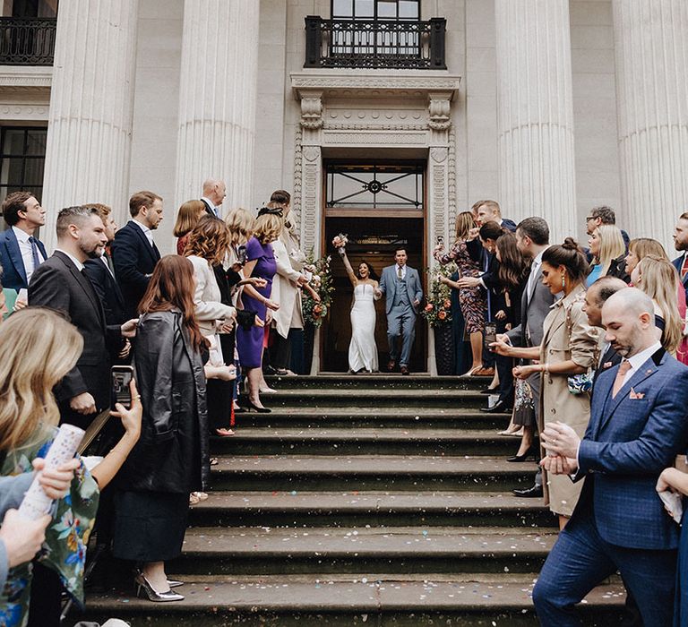 Iconic confetti exit moment for the bride and groom at Old Marylebone Town Hall