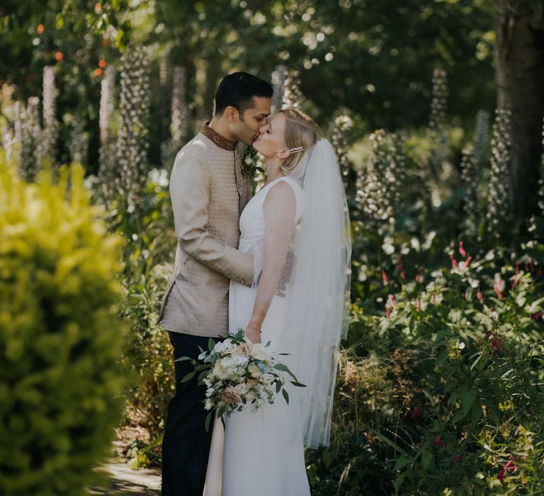 Bride and groom embracing at micro wedding 