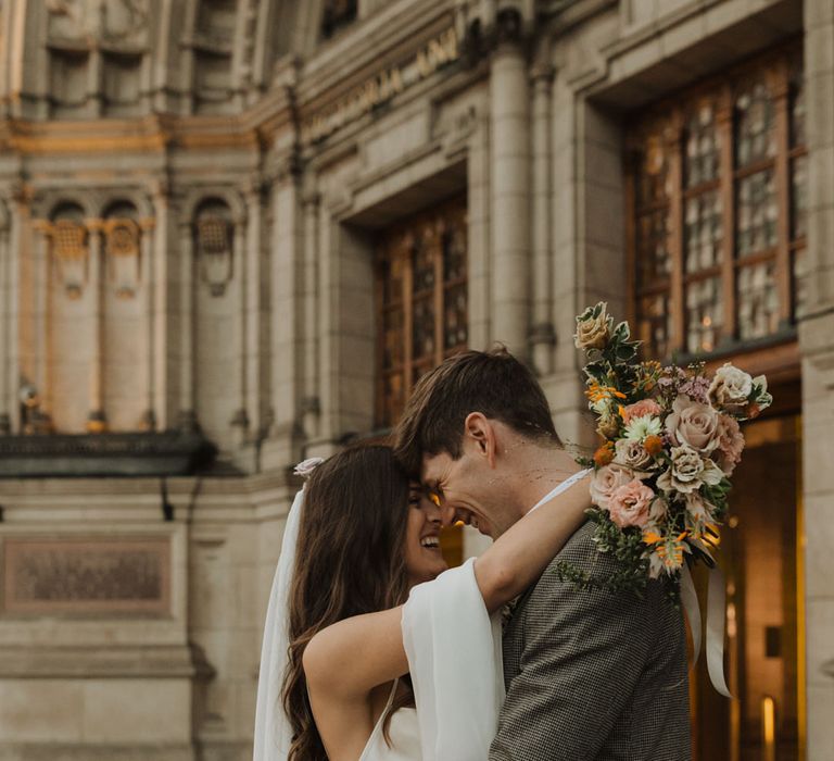 Bride and groom portrait outside their Holy Trinity Brompton Church micro wedding 