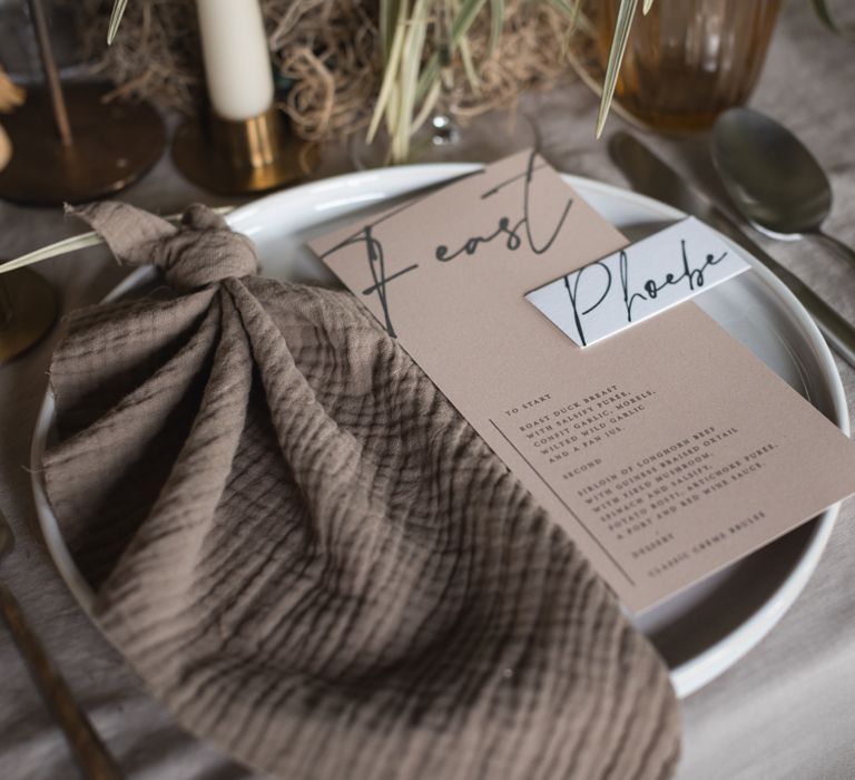 Place setting with contemporary menu card and calligraphy name place card 