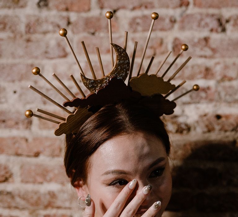 Bride with a celestial headdress and stylish nail art 