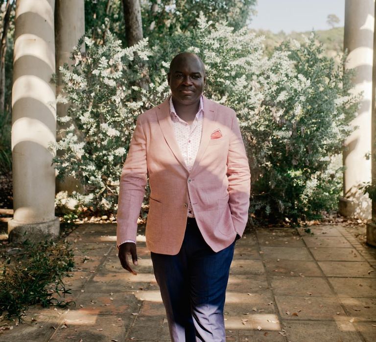 Groom in pink linen style dinner jacket for French wedding