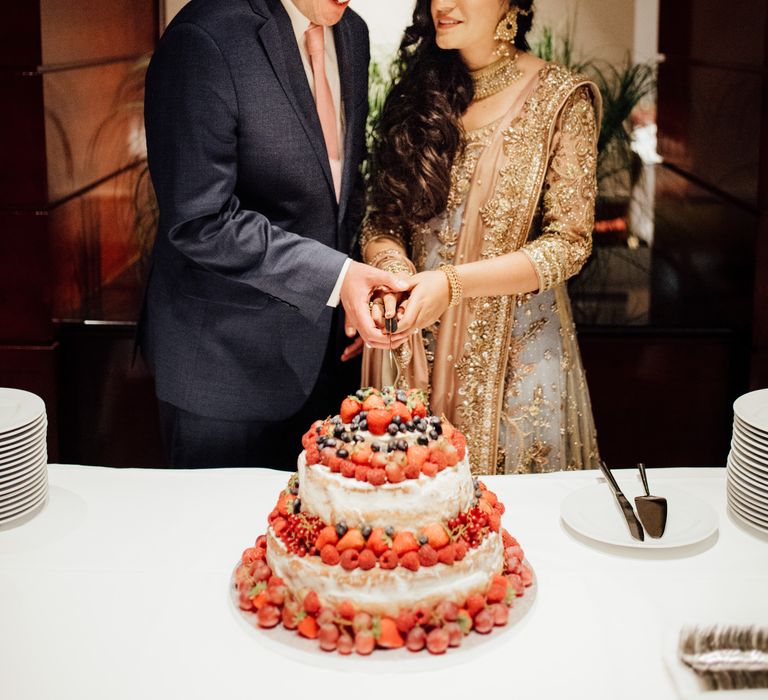 Bride & groom cut wedding cake