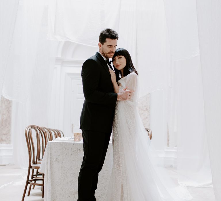 Minimal wedding inspiration at Bylaugh hall with hanging drapes and black tie attire