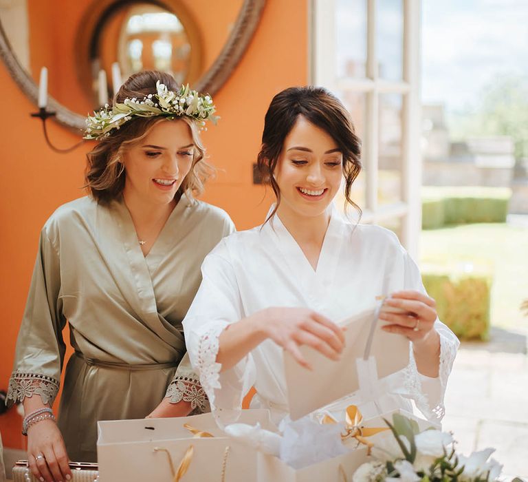 Bride opens presents on the morning of her wedding day 