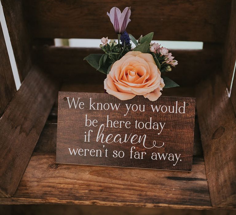 Wooden plaque in wooden crates for those in heaven