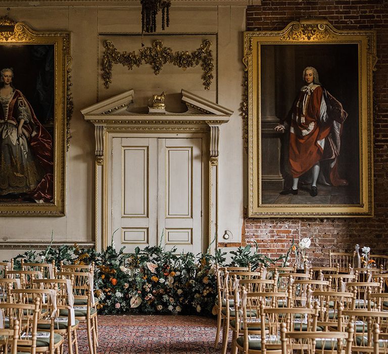 St Giles House in Dorset country house wedding venue with an orange and peach wedding flower arrangement decorating the altar