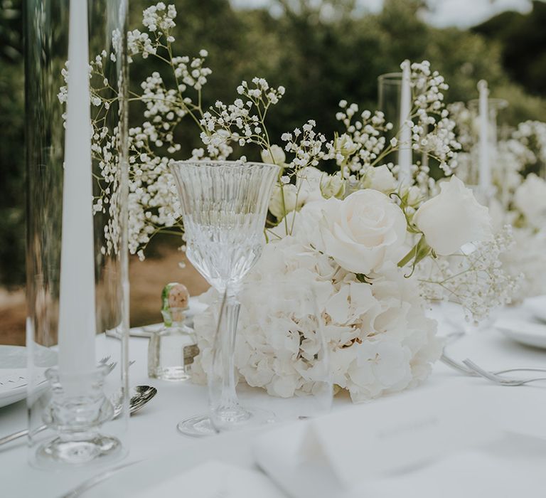 white hydrangea roses and gypsophila table centrepiece flowers