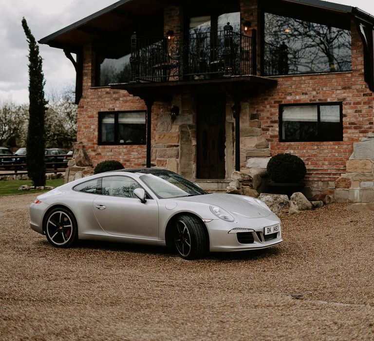 Willow Marsh Farm Loughborough wedding venue with silver wedding sports car 