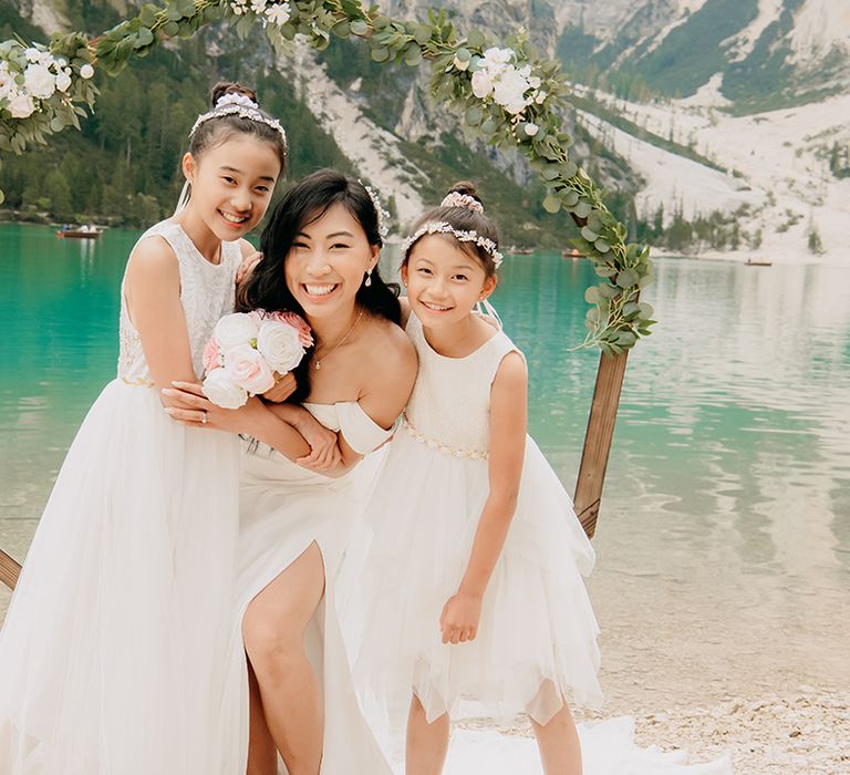 Flower girls wearing white dresses for intimate micro wedding 