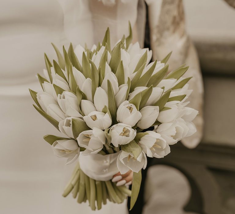 All white tulip wedding bouquet for grand luxury wedding at the banqueting house in London