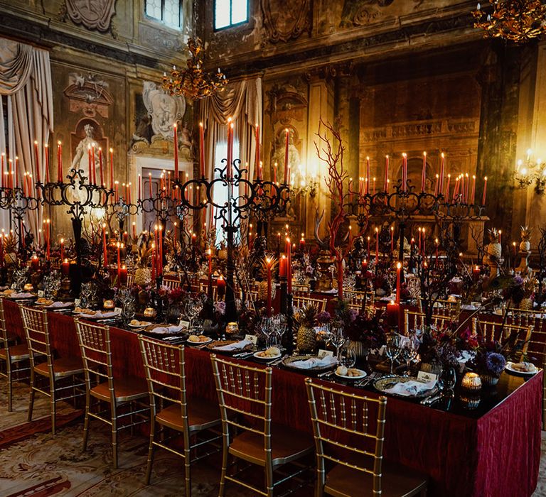 Ca'Sagredo hotel wedding venue with gothic wedding tablescape with red, black and gold decorations and details 