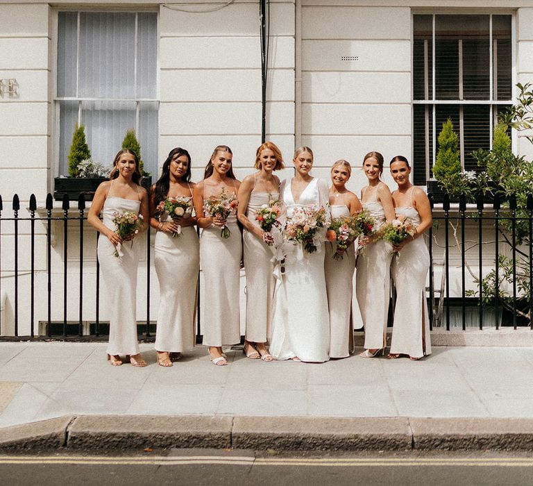 London city wedding with the bridal party wearing neutral bridesmaid dresses from Meshki 