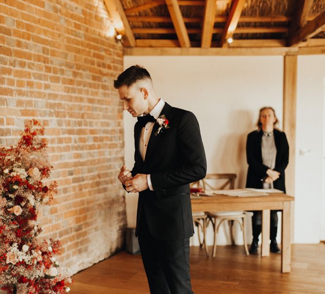 Groom waiting for his bride at Brickhouse Vineyard